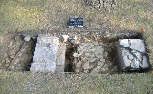 This excavation unit shows the western wall and a stone support pier for a hallway or staircase of cottage number 1 that was built in 1822.